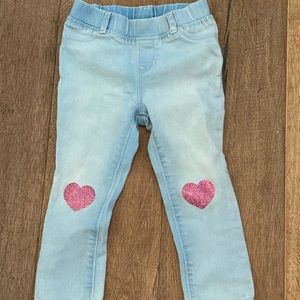 Light colored jeans with pink glittery hearts on the knee. Size 3T